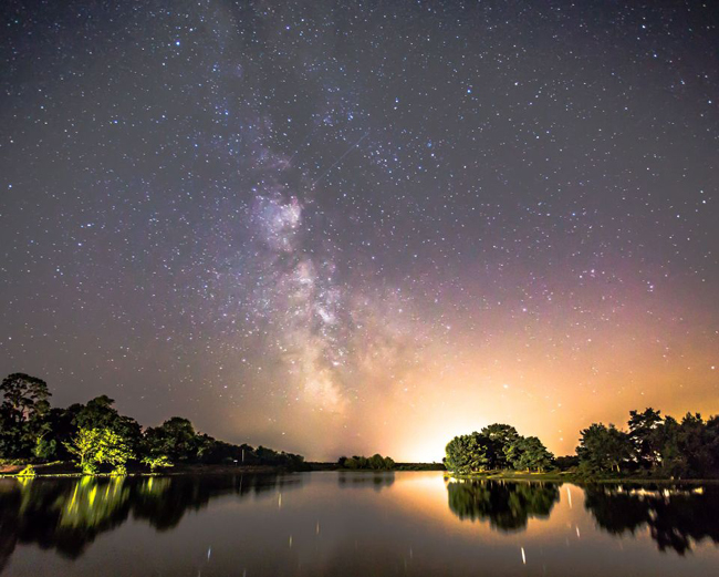 CREDIT: Matt pinner/Rex Shutterstock. Editorial use only Mandatory Credit: Photo by Matt pinner/REX/Shutterstock (5827471a) Milky Way and Perseid meteor shower over Hatchet Pond Milky Way and Perseid meteor shower over Hatchet Pond, Brockenhurst, Hampshire, UK - 10 Aug 2016