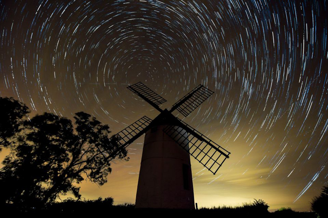 A composite image made from 726 photographs taken over three hours from midnight showing the rotation of the earth around Polaris, the North Star, in the night sky over Ashton Windmill, Somerset ahead of the Perseid meteor shower, which is due to reach its peak between Thursday and Saturday. PRESS ASSOCIATION Photo. Picture date: Wednesday August, 10, 2016. Photo credit should read: Ben Birchall/PA Wire