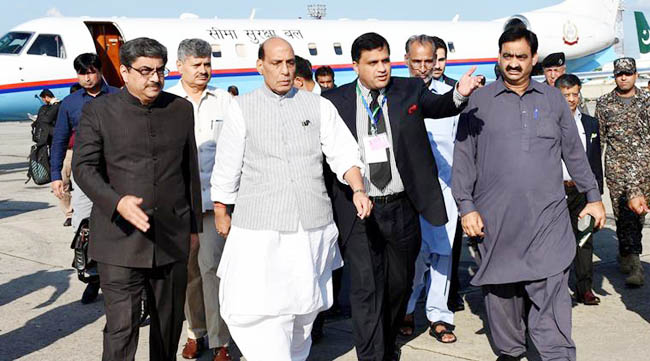 Pakistani official escort visiting Indian Interior Minister Rajnath Singh, second from left, arrives to attend a meeting of the South Asian Association for Regional Cooperation, in Islamabad, Pakistan, Wednesday, Aug. 3, 2016. Hundreds of Pakistanis have rallied in the capital against the imminent visit of India's interior minister. (AP Photo)