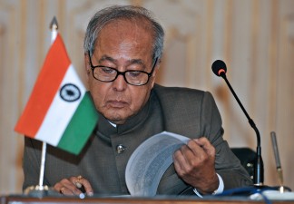 Indian Foreign Minister Pranab Mukherjee reads documents during a joint press briefing with his Pakistani counterpart Shah Mehmood Qureshi at the end of two day peace talks at the foreign ministry in Islamabad on May 21, 2008. India and Pakistan wrapped up their latest round of peace talks on Wednesday, saying that they had made significant progress and had signed a pact on giving consular access to prisoners. AFP PHOTO/Farooq NAEEM (Photo credit should read FAROOQ NAEEM/AFP/Getty Images)